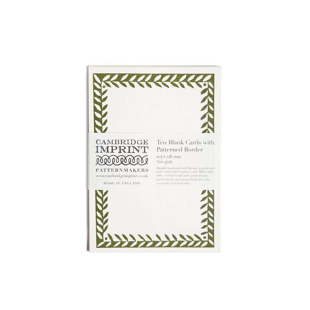 Pack of Cambridge Imprint blank cards with green leaf border on a white background
