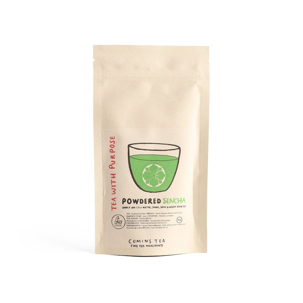 Kraft bag of powdered sencha green tea by Comins Tea on white background