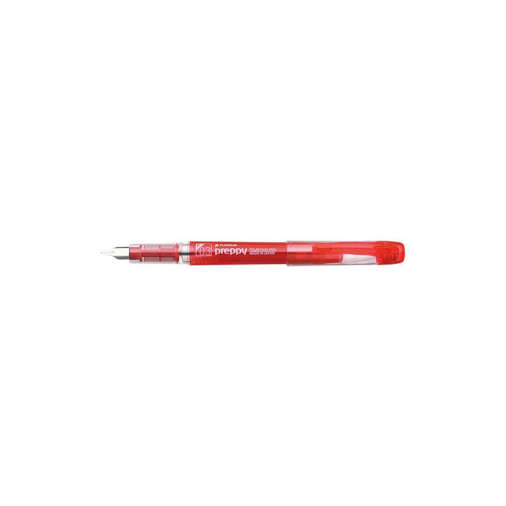 Red fountain pen with visible branding on a white background