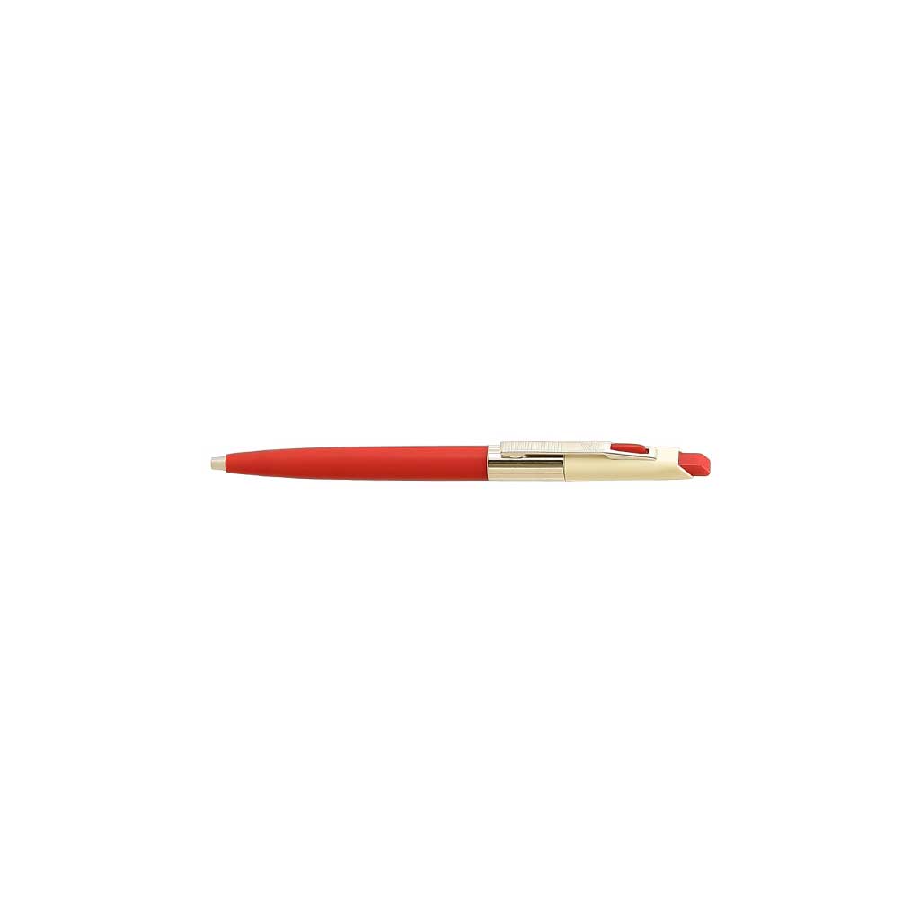 Red pen with gold accents on a white background