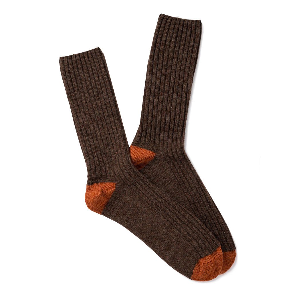 Pair of brown wool socks with orange toes and heels.