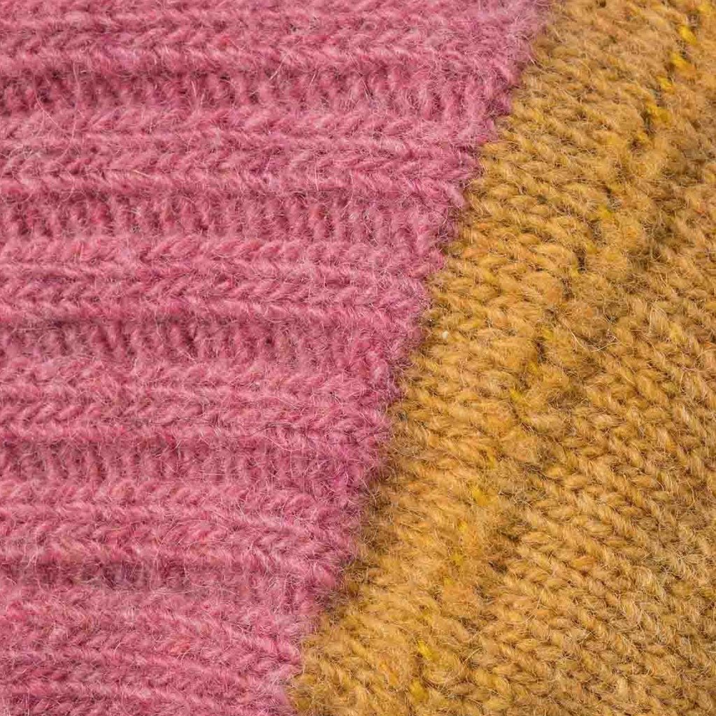 Close-up of pink and yellow wool sock