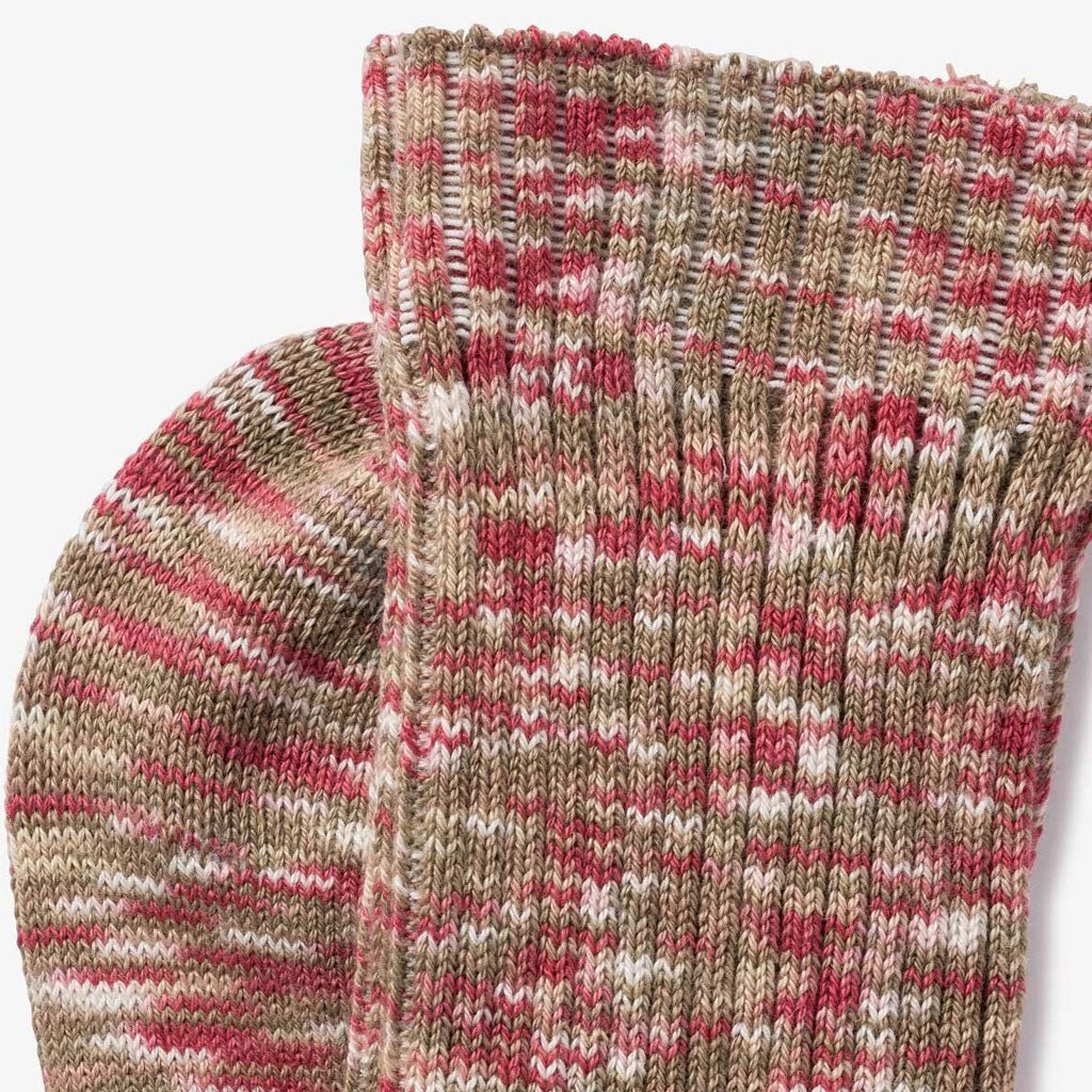Close-up of multicolored socks in a heathered blend of blush pink, sand, and cream.