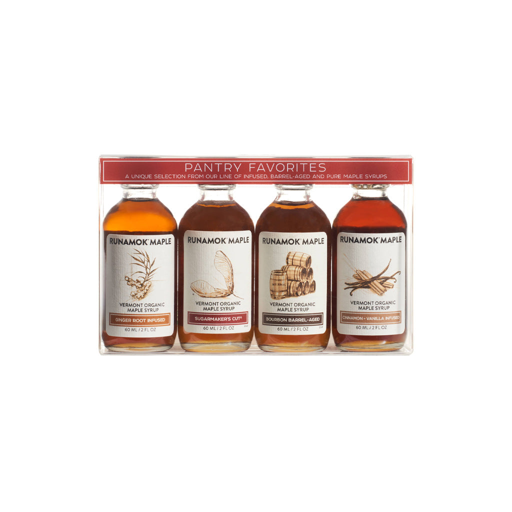 Set of four Runamok maple syrup bottles in clear packaging.