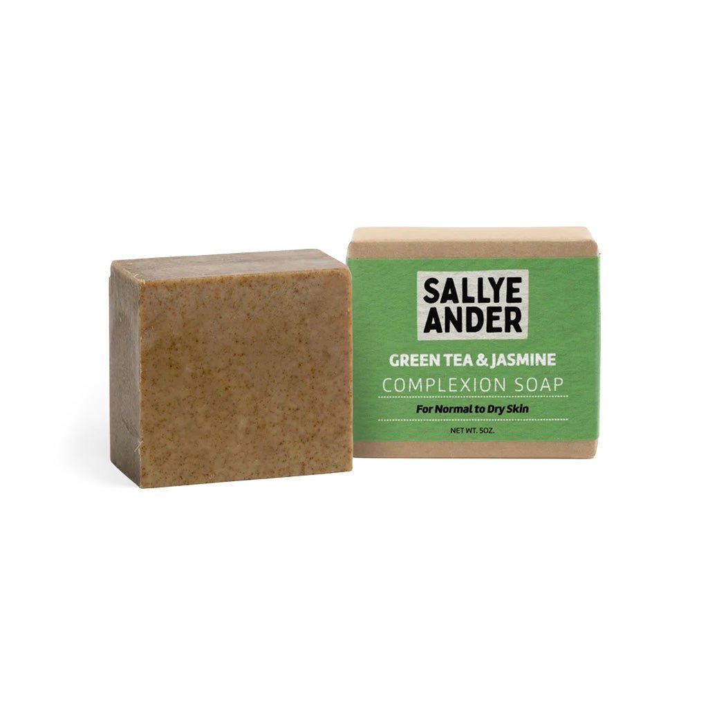 Bar of green tea and jasmine complexion soap next to packaging with green SallyeAnder label on white label
