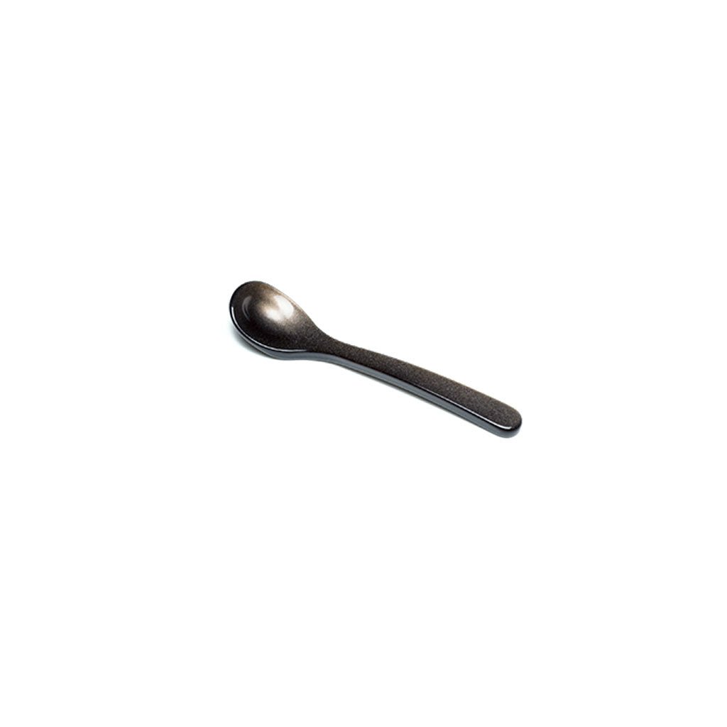 Brownish gray acrylic salt spoon on white background