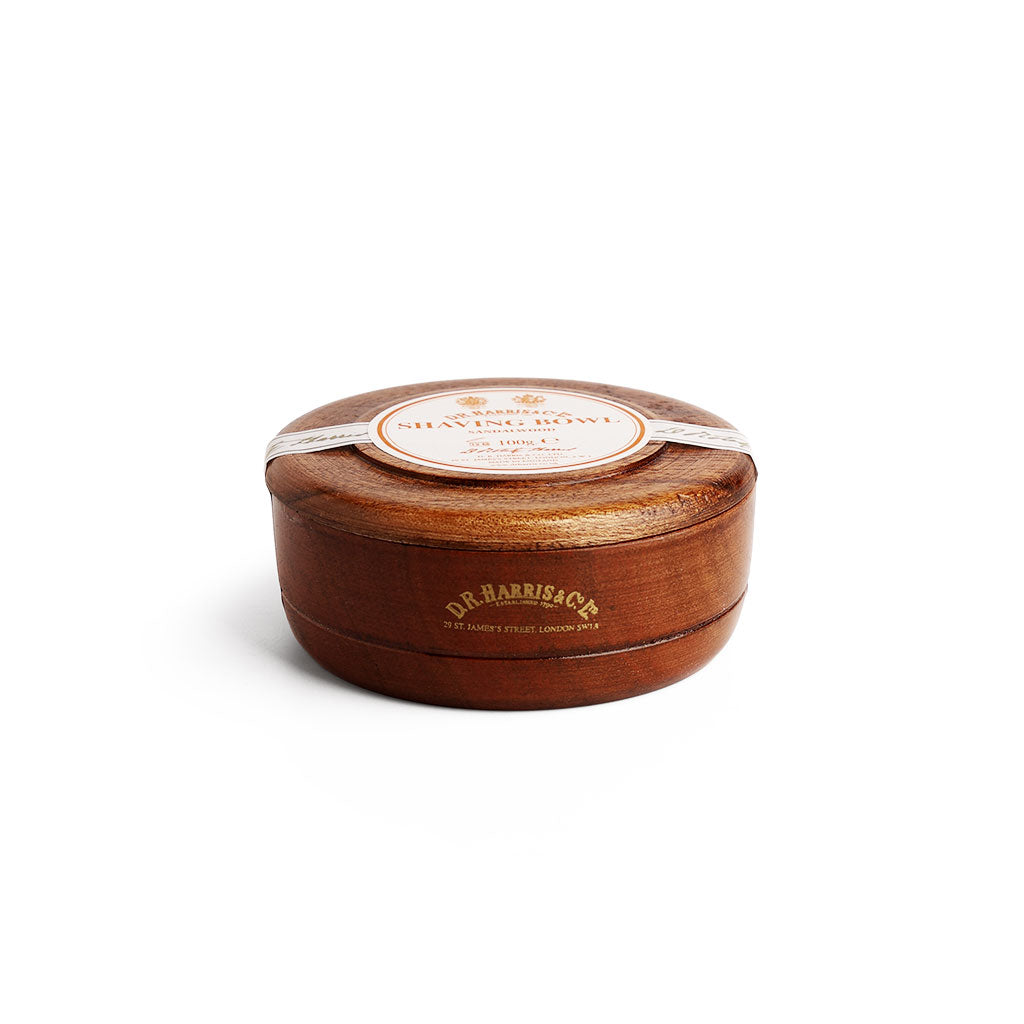 Wooden shaving bowl with a Sandalwood label on a white background