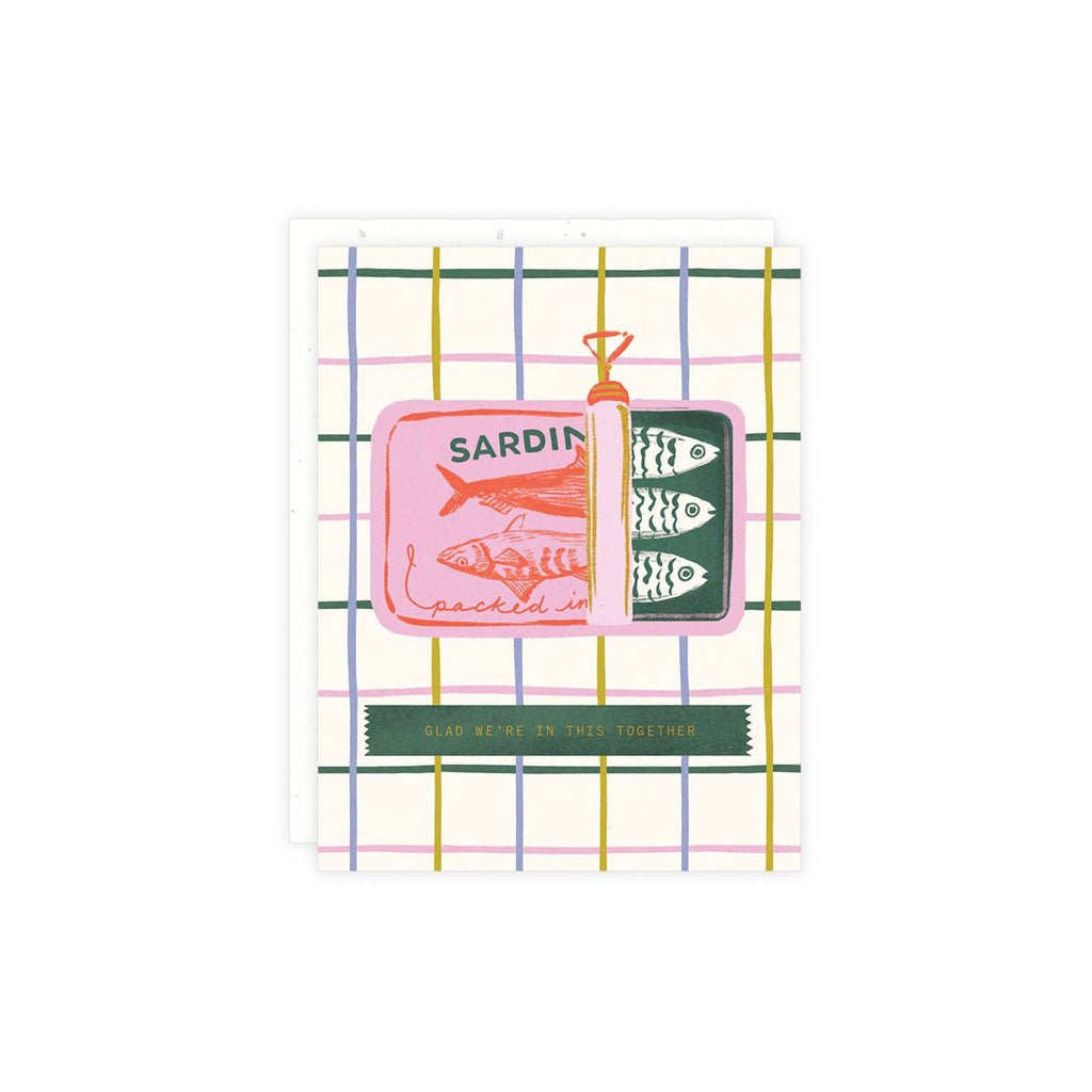 A greeting card with an illustration of sardines in a tin, with the words Glad We're In This Together