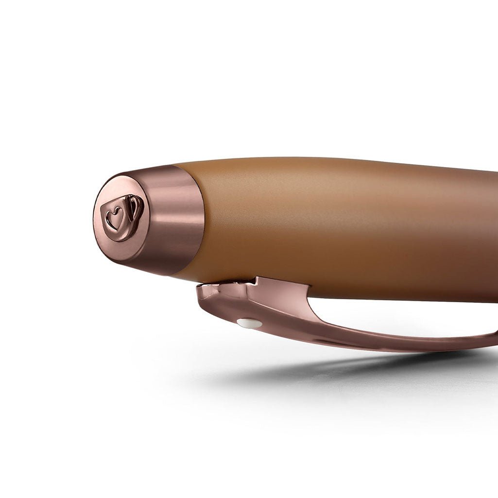 Brown ballpoint pen with rose gold accents on white background