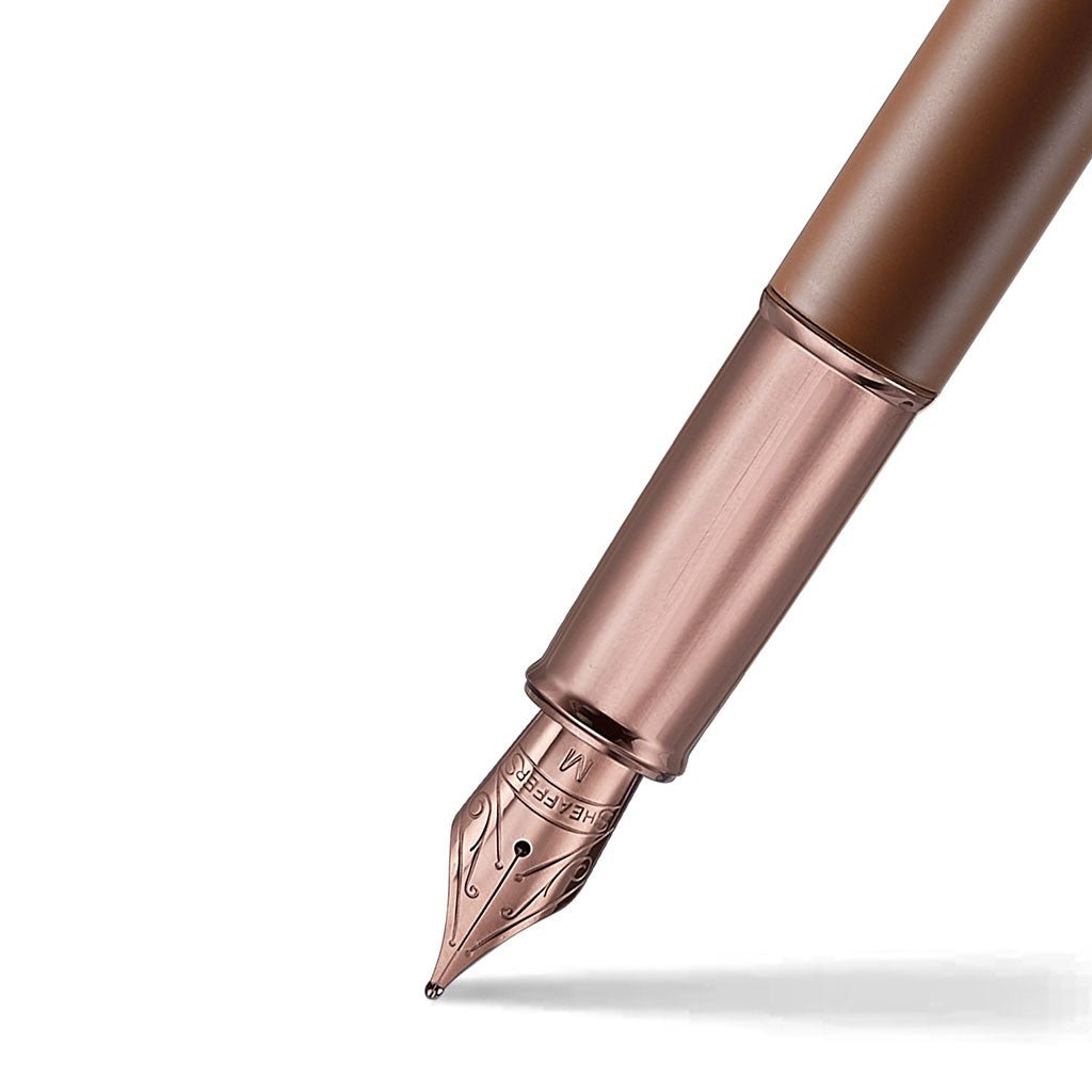 Rose gold fountain pen on a white background