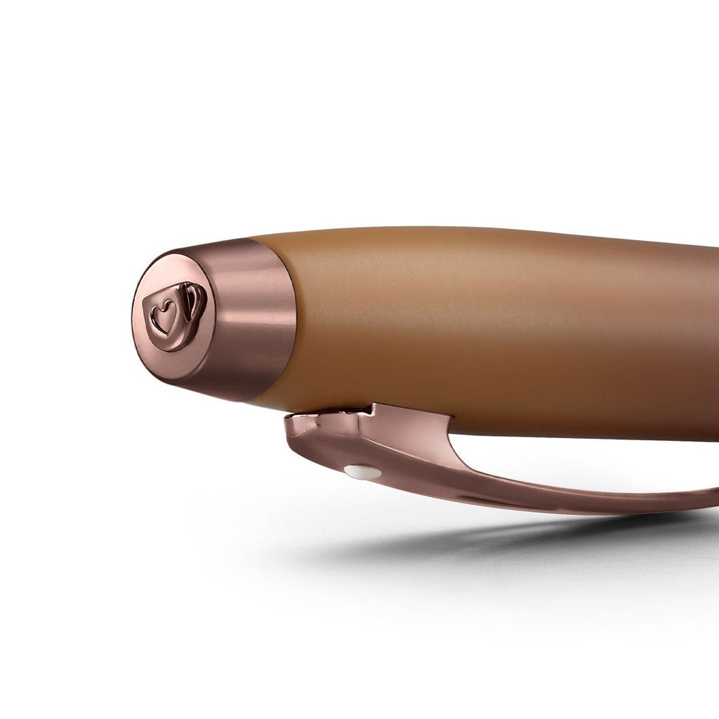 Brown and rose gold pen cap on a white background