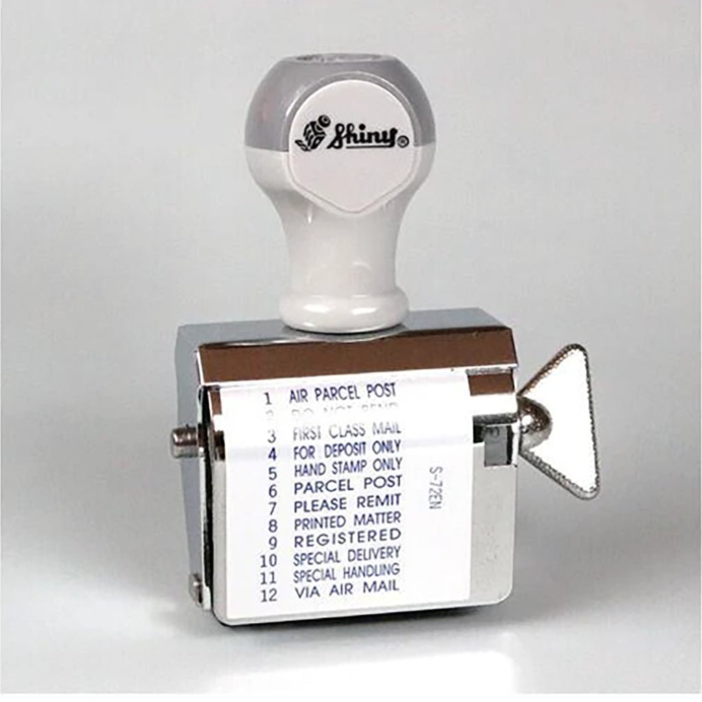 A rotating handheld stamp showing the following phrases:
1. AIR PARCEL POST
2. DO NOT BEND
3. FIRST CLASS MAIL
4. FOR DEPOSIT ONLY
5. HAND STAMP ONLY
6. PARCEL POST
7. PLEASE REMIT
8. PRINTED MATTER
9. REGISTERED
10. SPECIAL DELIVERY
11. SPECIAL HANDLING
12. VIA AIR MAIL