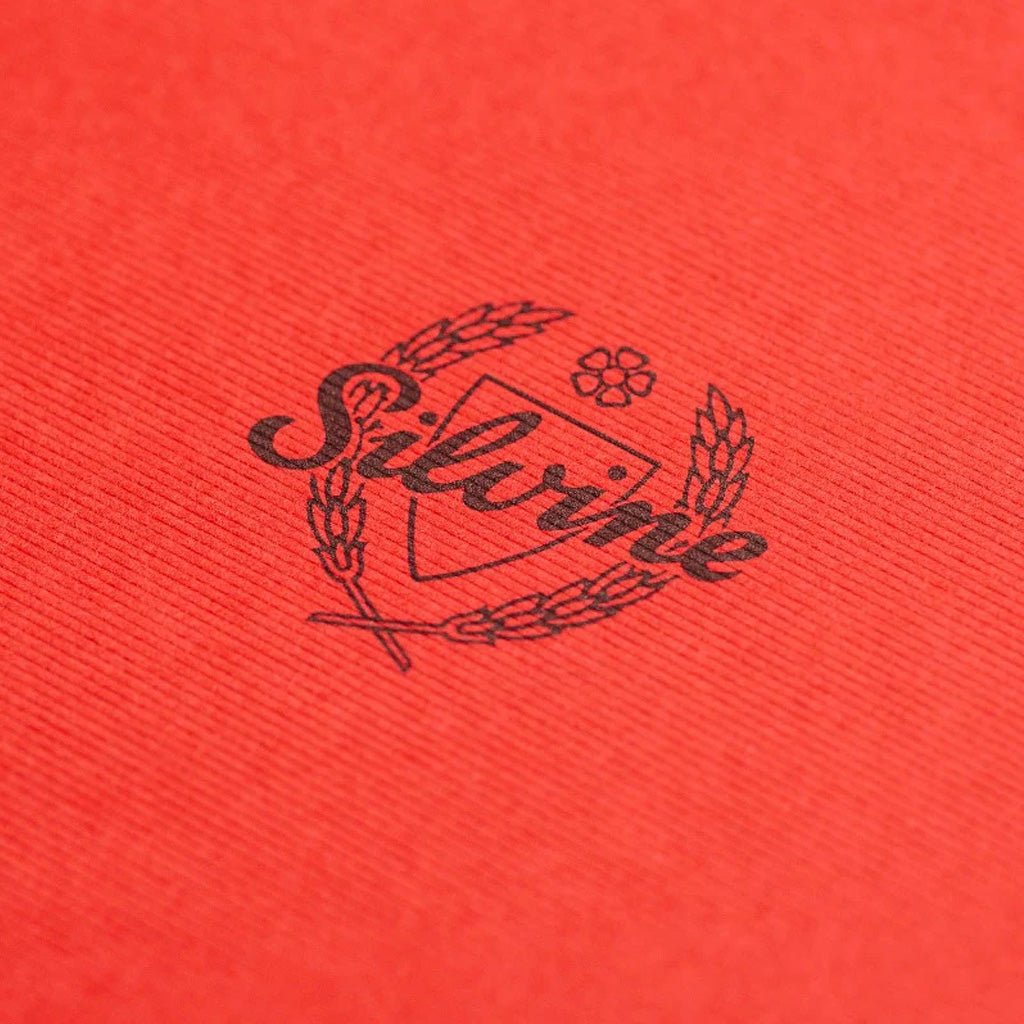 Close up of Silvine logo on red notebook cover