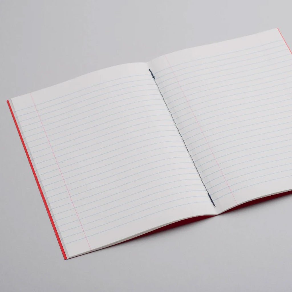 Open lined notebook on light background