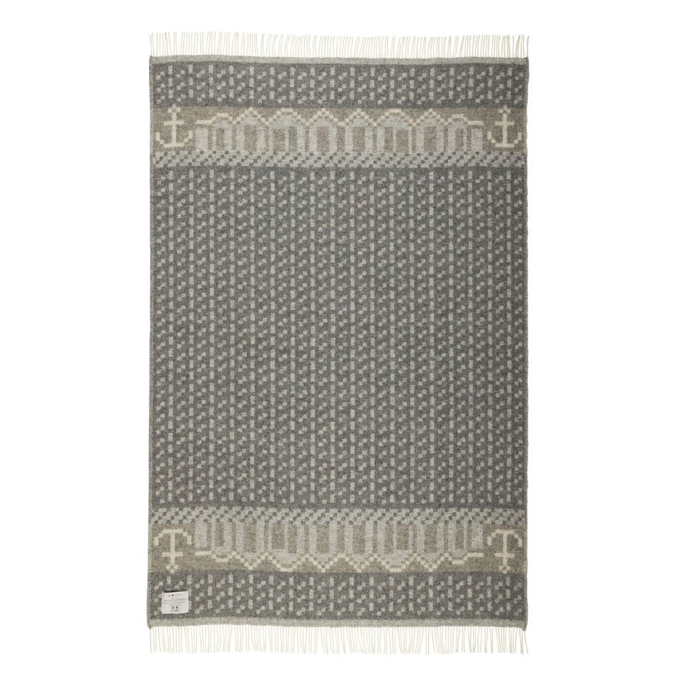 Textile with a pattern of anchors on a gray background