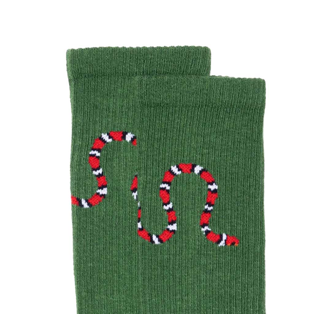 Green sock with a red and black snake design on a white background