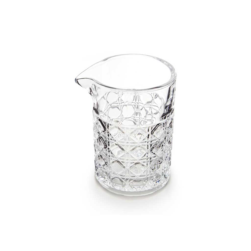 Clear mixing glass with diamond pattern on white background