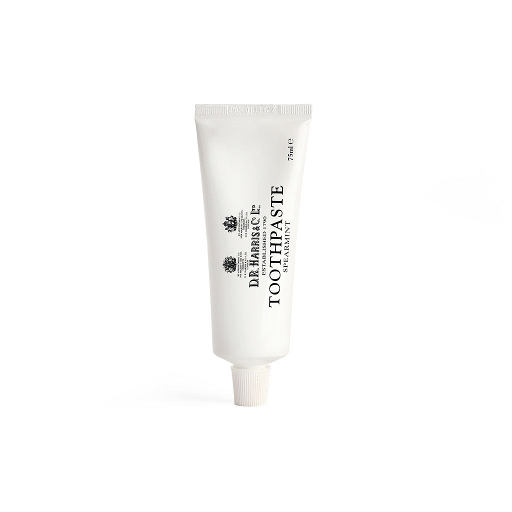 D.r. Harris spearmint toothpaste tube on a white background
