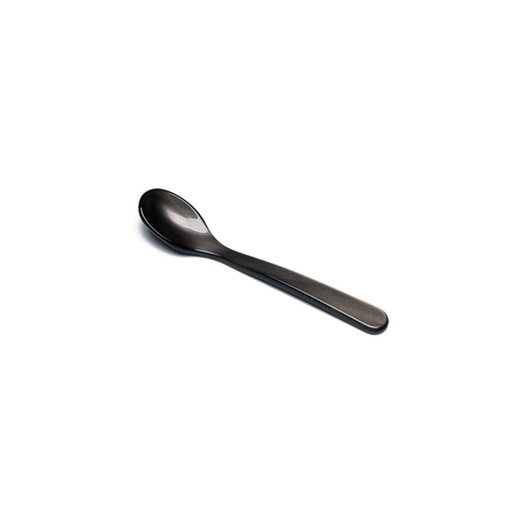 Brownish gray acrylic salt spoon on white background