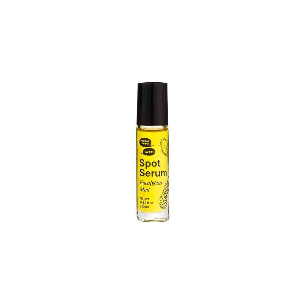 Spot Serum rollerball bottle with black cap and yellow liquid on a white background