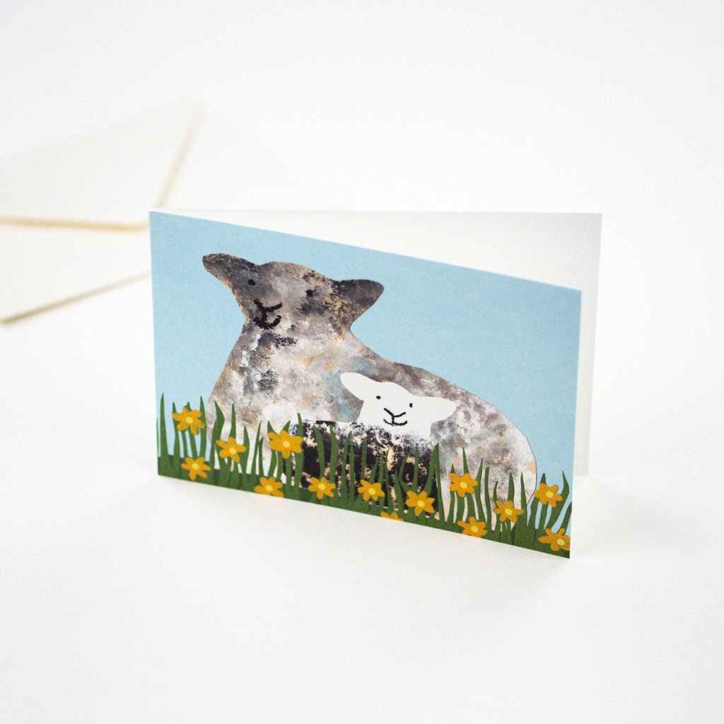 Illustrated sheep and baby lamb card standing up on light background