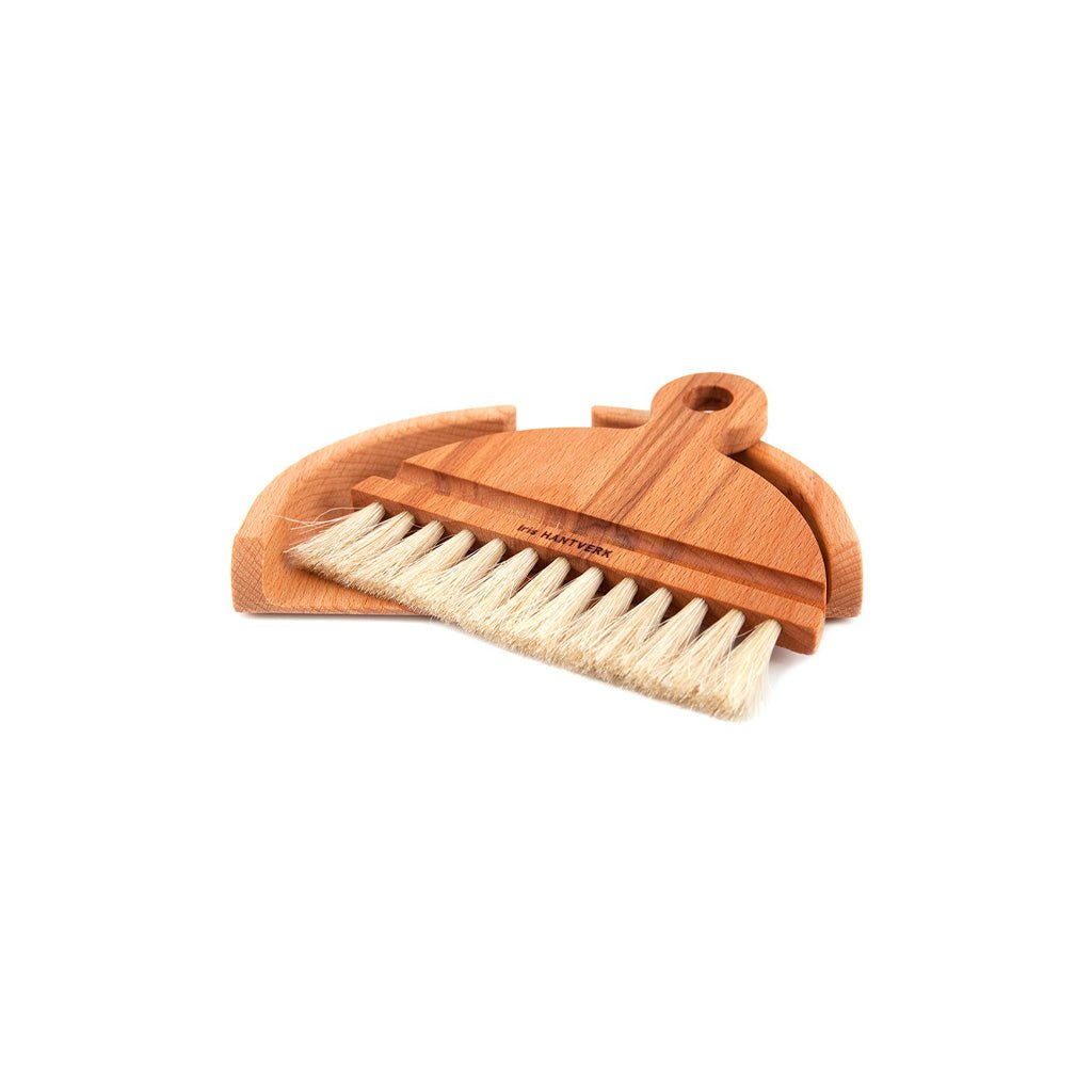 Wooden table brush set with horsehair bristles on white background