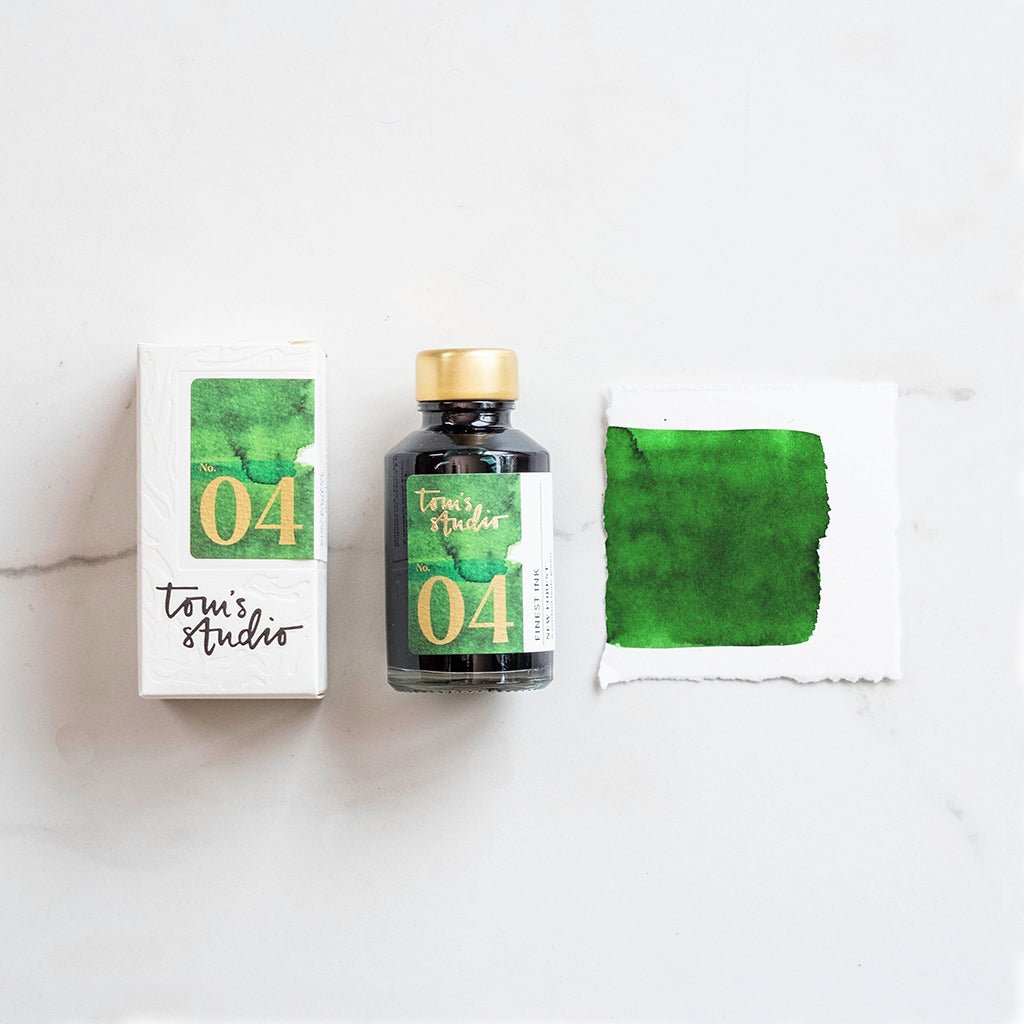 Toni's Studio ink bottle with packaging and swatch on a white background