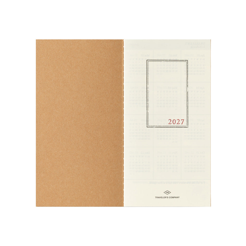 An open Traveler's Notebook refill with 2027 page on white background