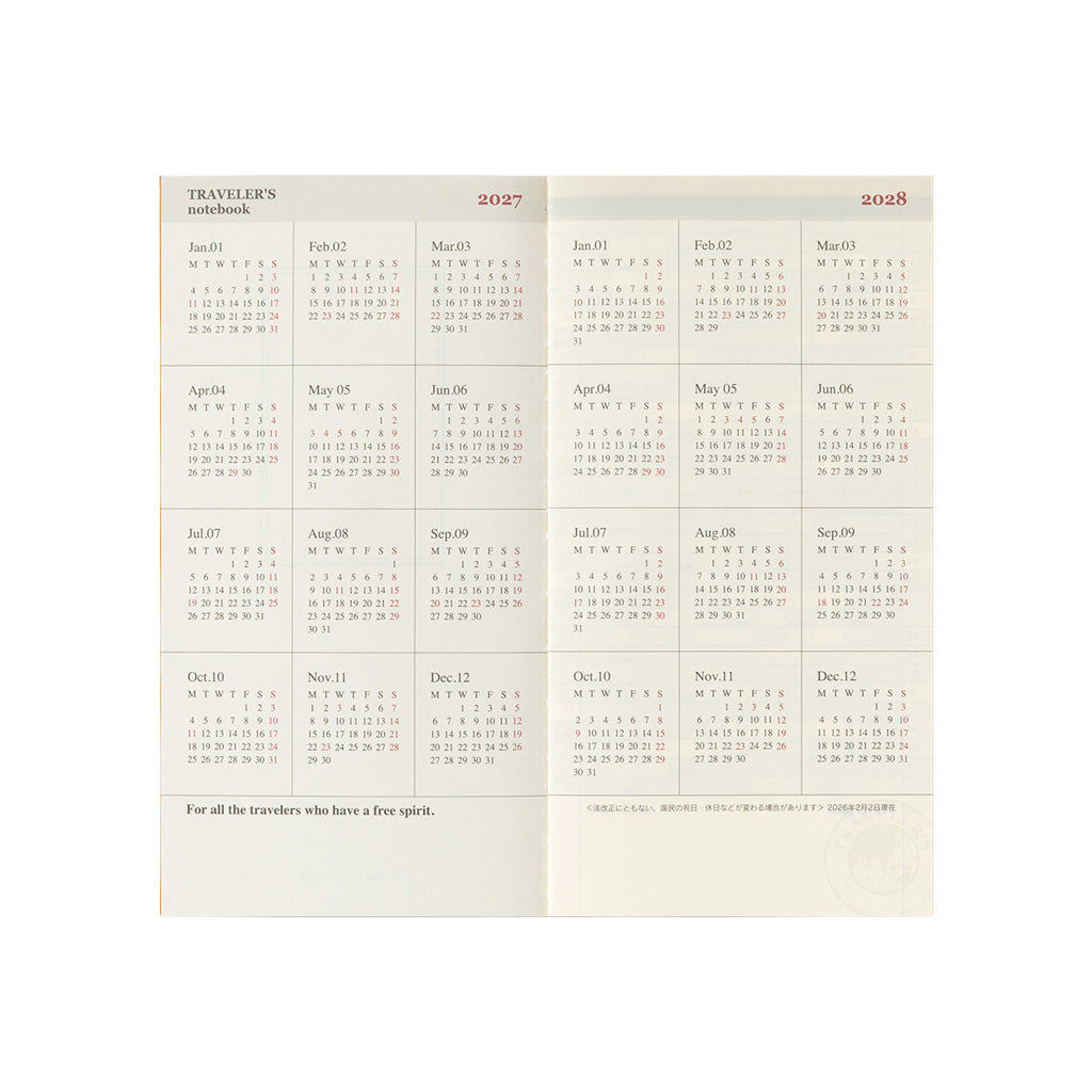 An open Traveler's Notebook refill with 2027 and 2028 year pages on white background