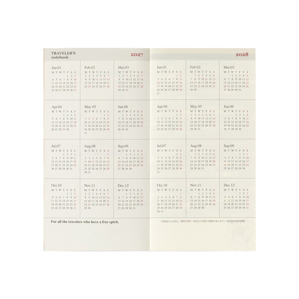 An open Traveler's Notebook refill with 2027 and 2028 year pages on white background