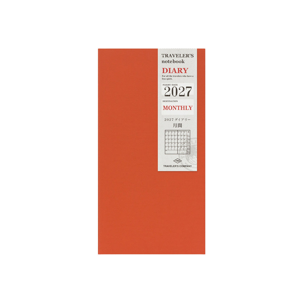 A Traveler's Notebook 2027 diary refill with monthly layouts and orange cover on white background