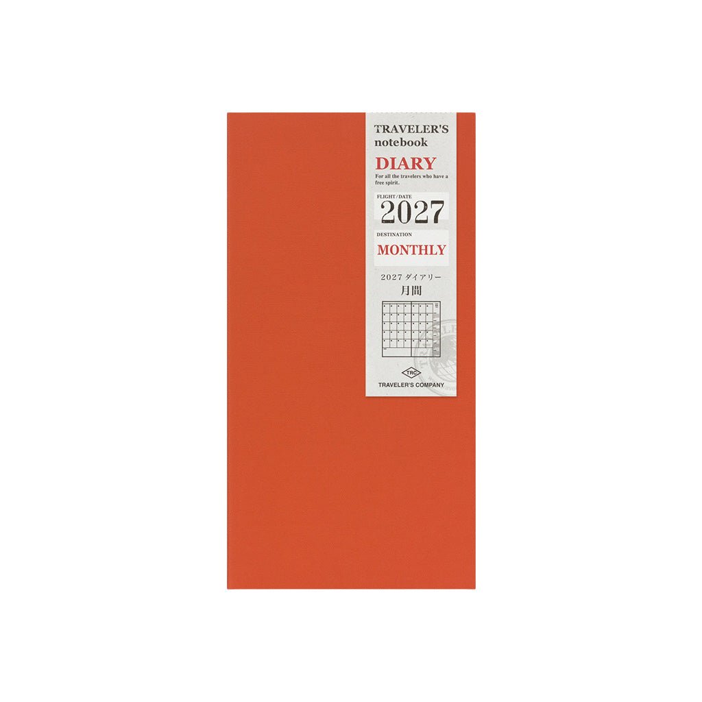 A Traveler's Notebook 2027 diary refill with monthly layouts and orange cover on white background
