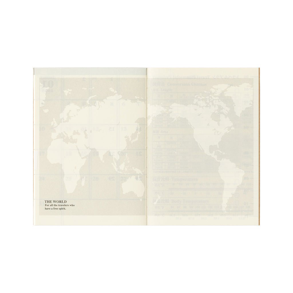 An open passport notebook refill with world map on white background.
