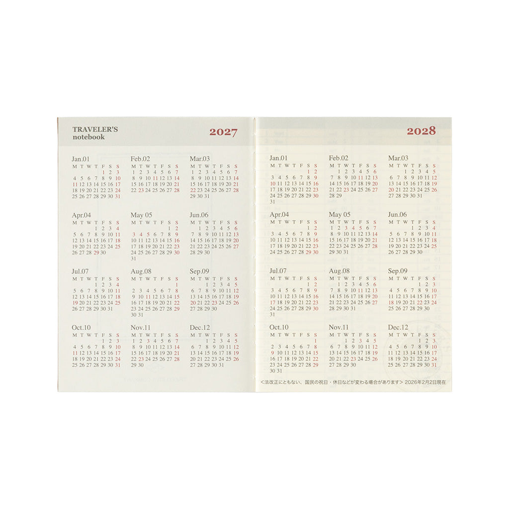 A two-page spread of a Japanese traveler's notebook passport calendar refill showing the years 2027 and 2028 with monthly grids in red and black text on a cream background.