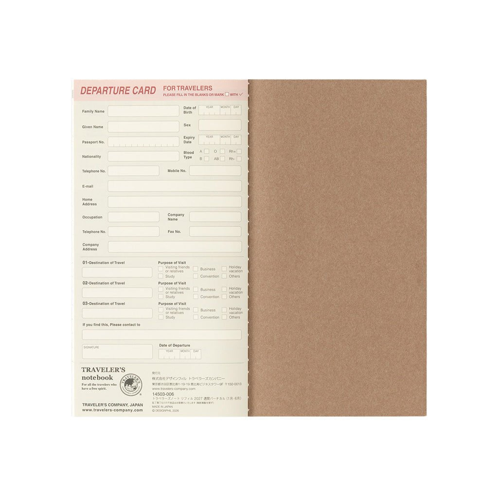 A traveler's notebook with a brown kraft paper cover, shown open to reveal cream-colored departure card pages with printed travel form fields.