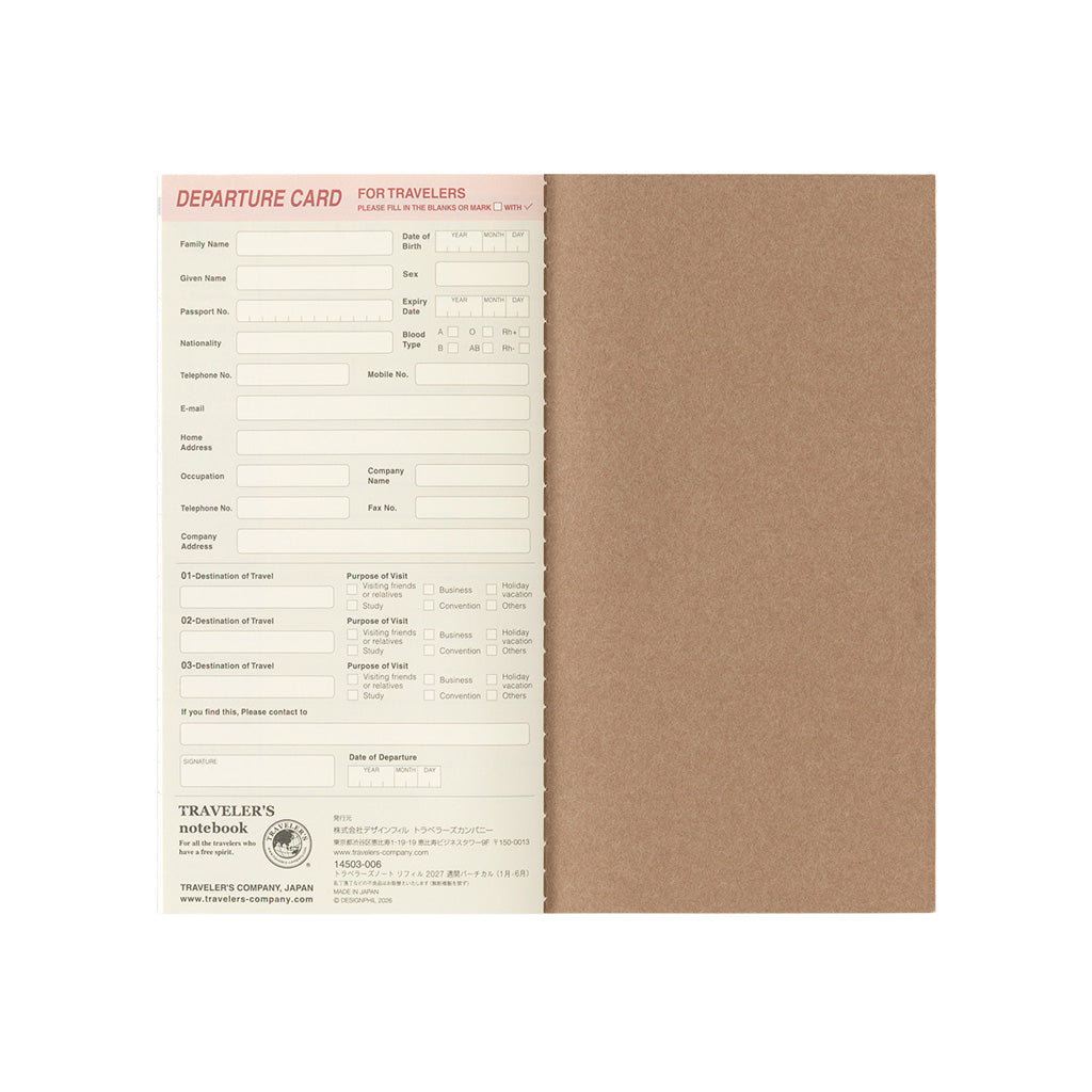A traveler's notebook refill with a brown kraft paper cover, shown open to reveal cream-colored departure card pages with printed travel form fields.