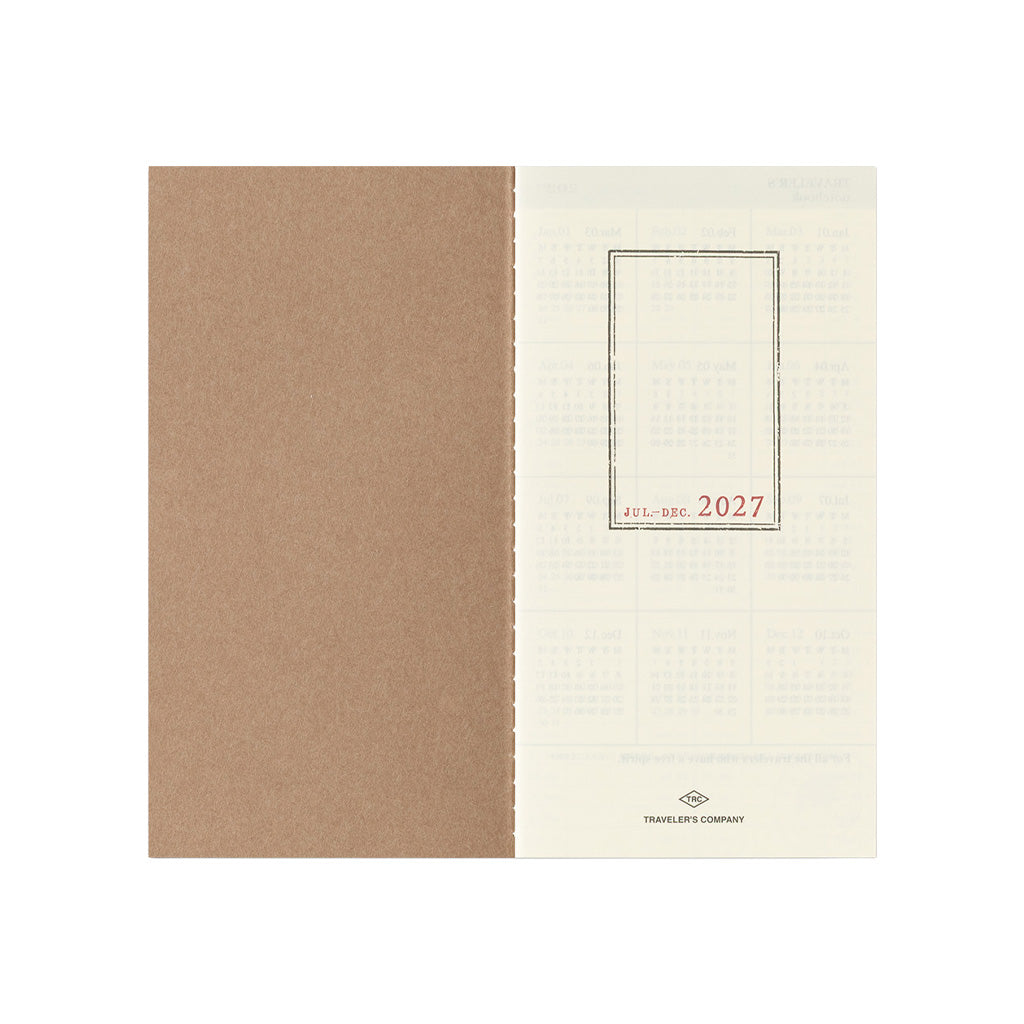 An open Traveler's Notebook refill for July through December 2027 on white background