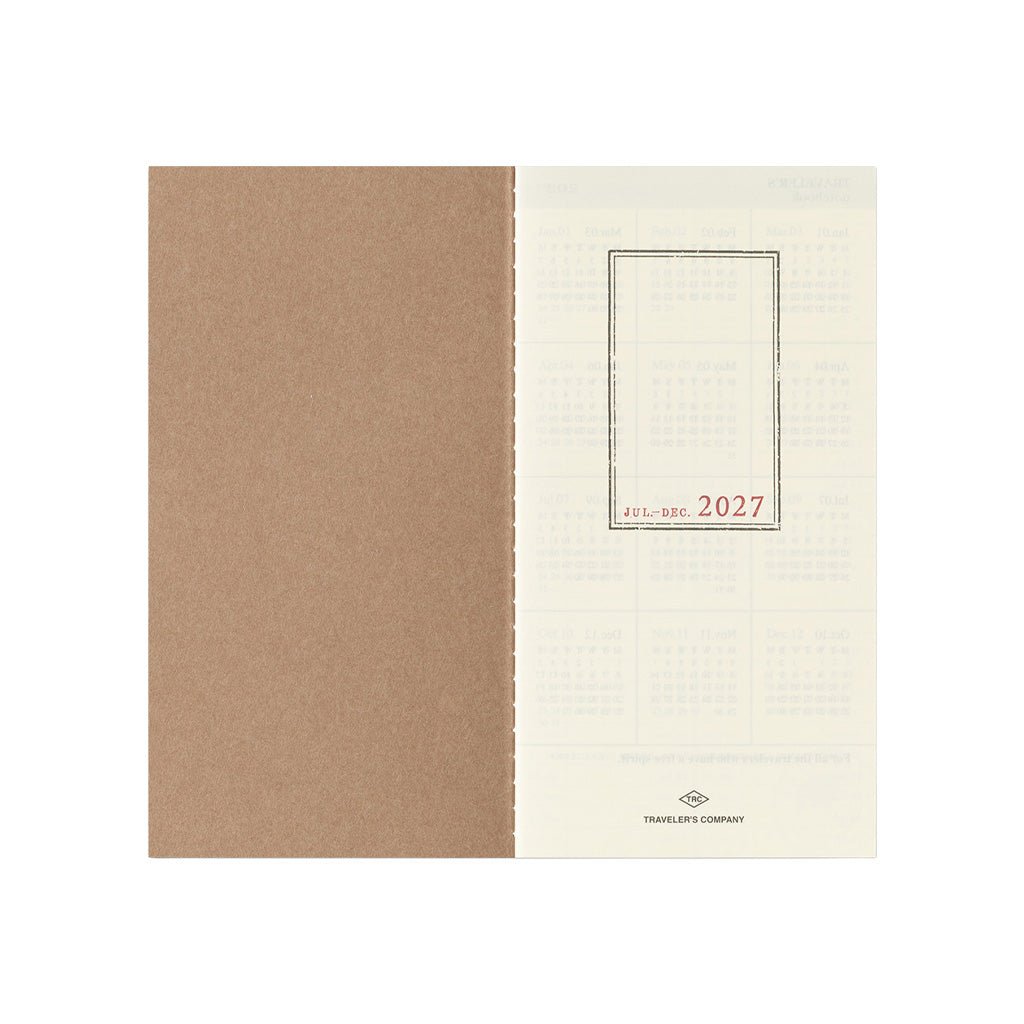 An open Traveler's Notebook refill for July through December 2027 on white background