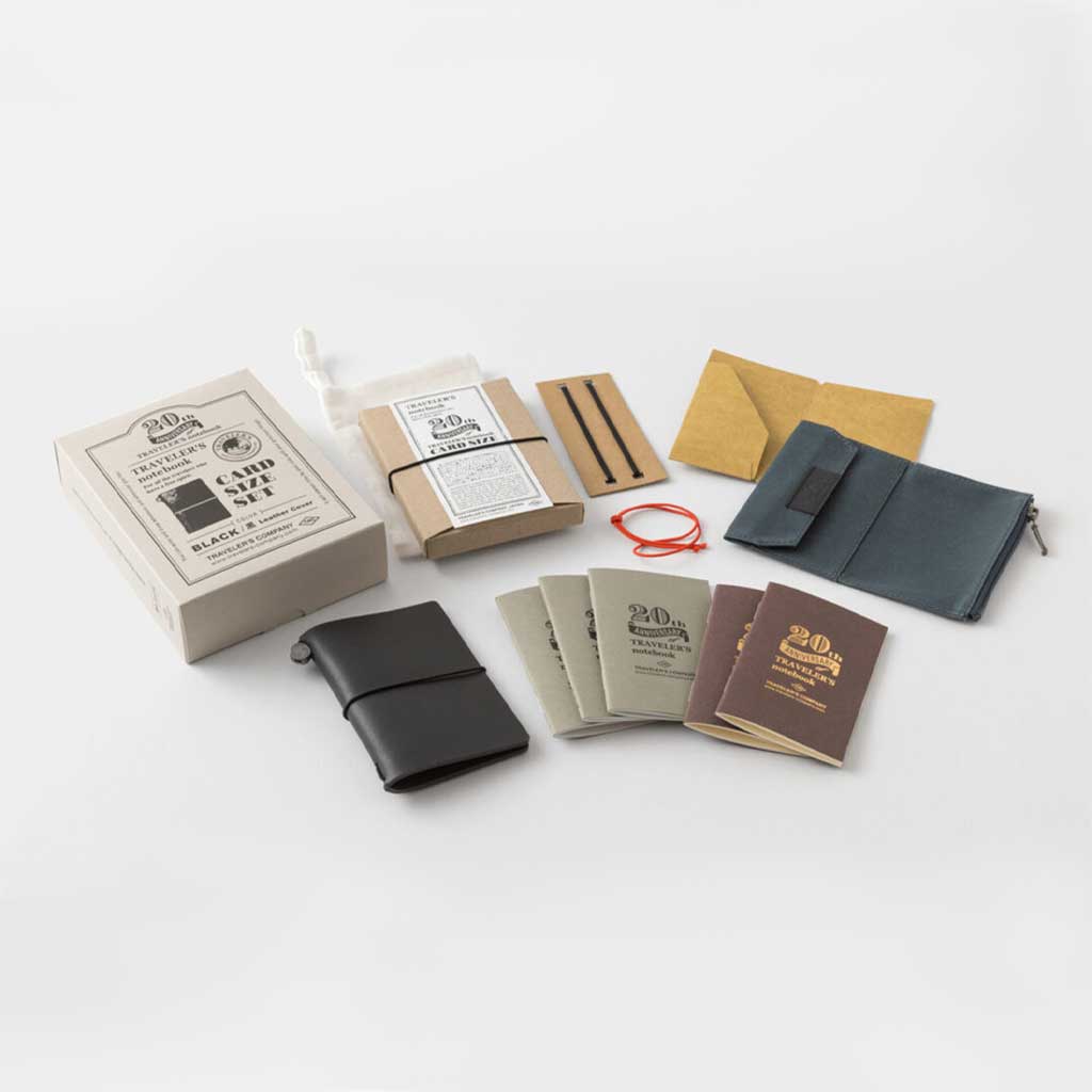 Contents of black Card-size anniversary set against light background