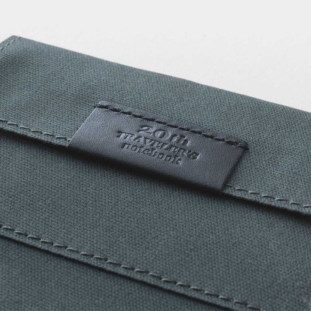 Black zippered case against light background