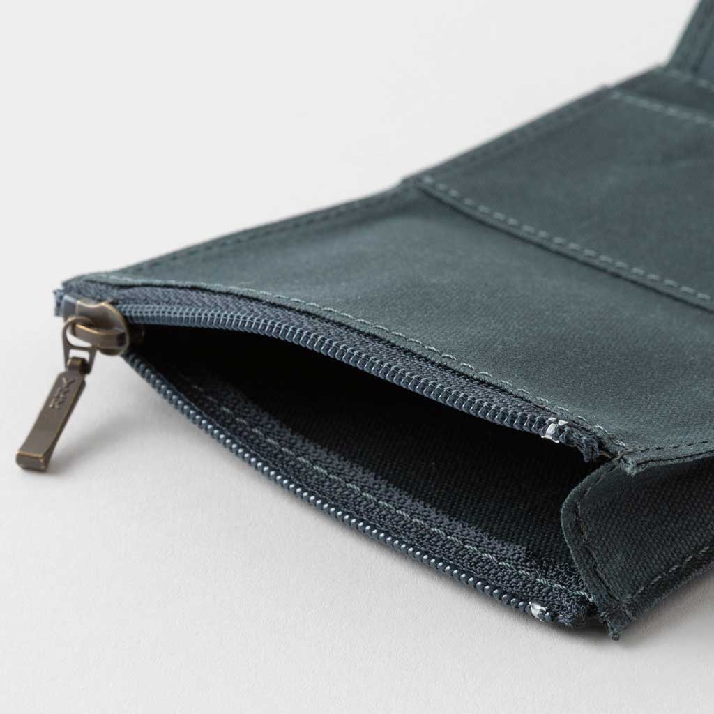 Open black zippered case against light background