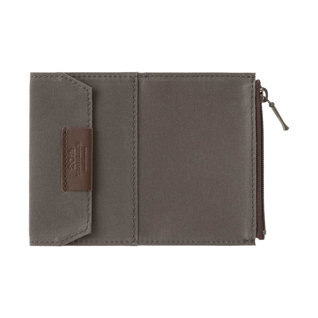 Brown card-size zippered case for traveler's notebook on white background
