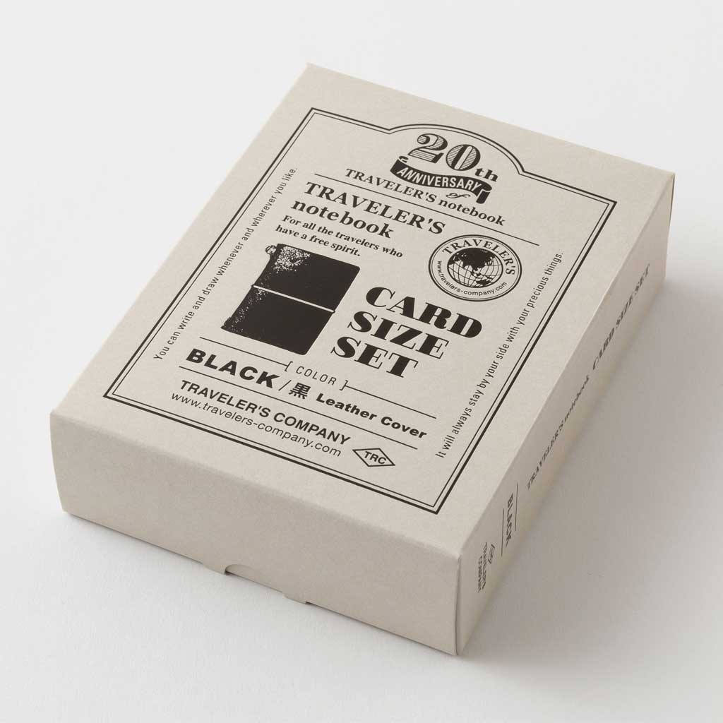 Box of Traveler's Company card size set with black leather cover on a white background