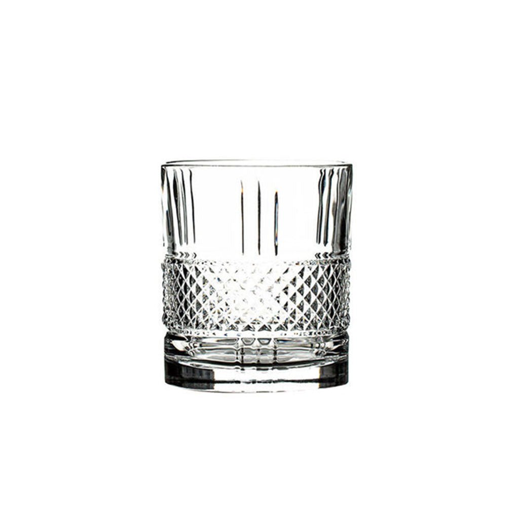 Clear old fashioned glass with diamond pattern on a white background