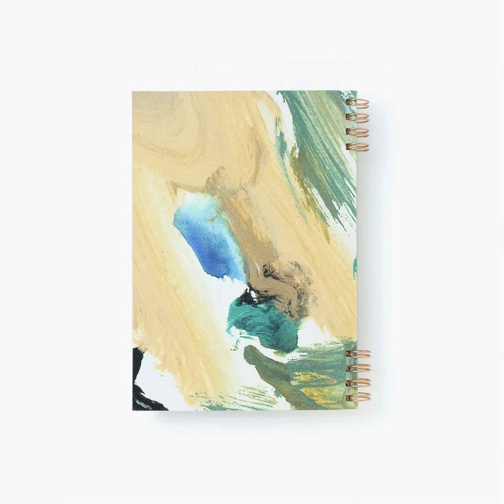 Notebook with artistic cover design on a white background