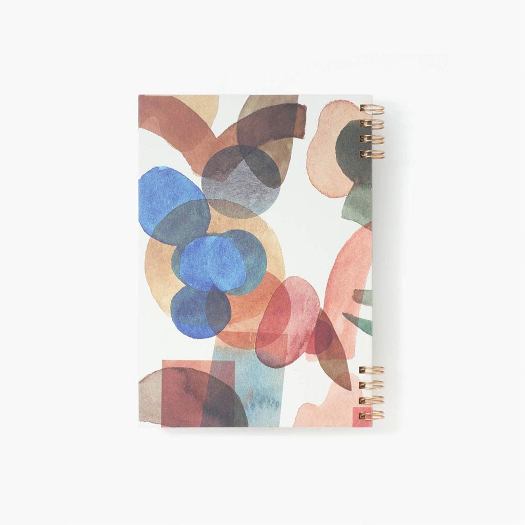 Notebook with abstract colorful design on a white background