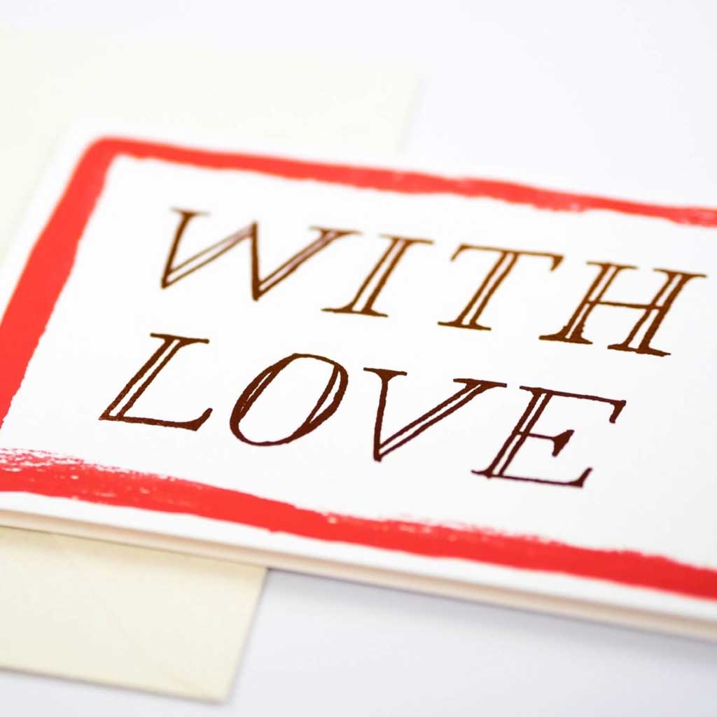 Card with 'WITH LOVE' metallic foiled text and red border on a white background