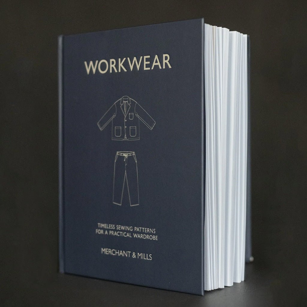 Book titled 'Workwear' by Merchant & Mills on a dark background