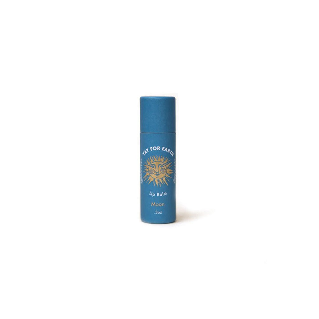 Blue Moon lip balm container with a sun design on a white background