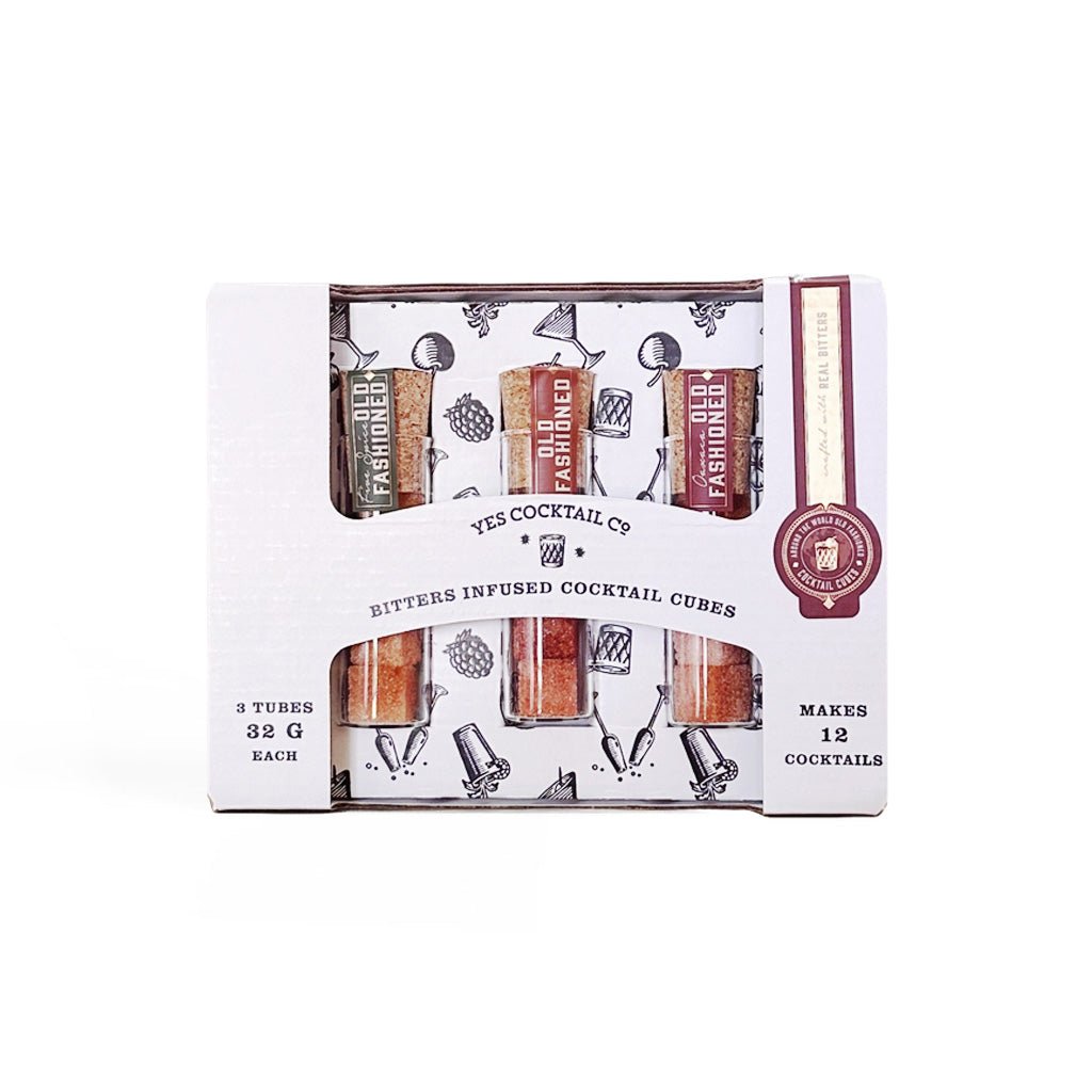 Yes Cocktail Co. Bitters Infused Cocktail Cubes in a white cardboard window box package containing three tubes of cocktail cubes.